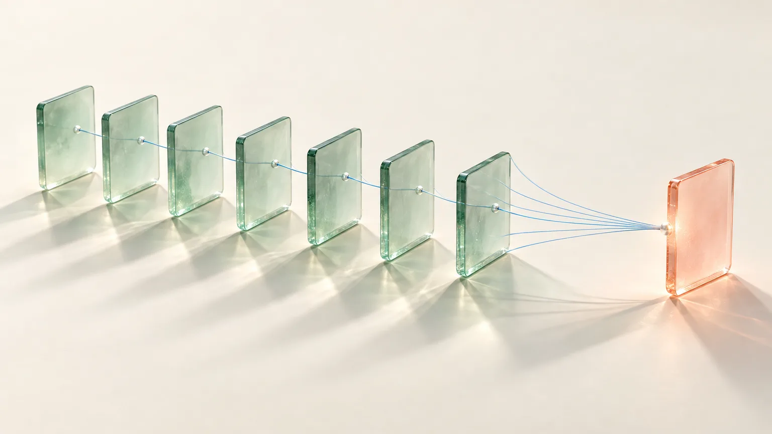 Des plaques de verre jade sont reliées par des fils bleus à une plaque corail.